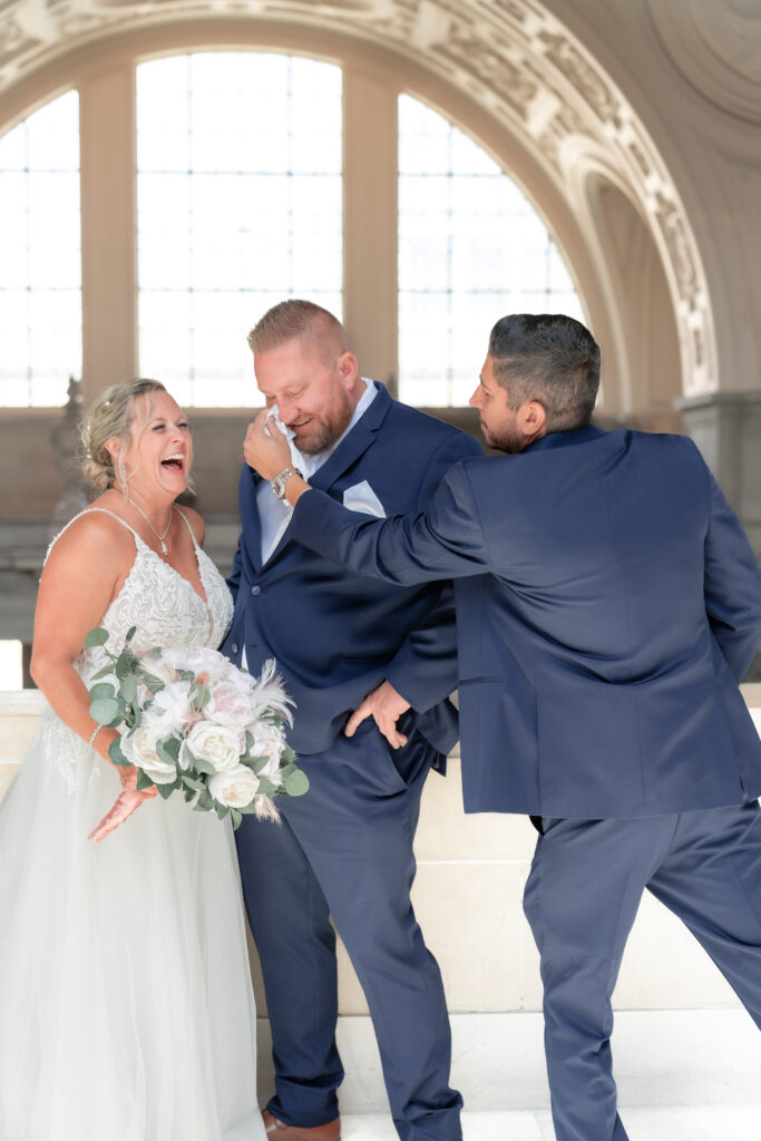 Best Man wiping Groom's tears
