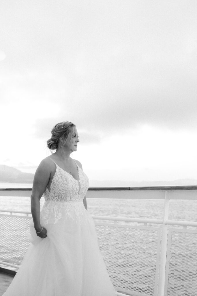 Bride Looking into distance on sunset cruise