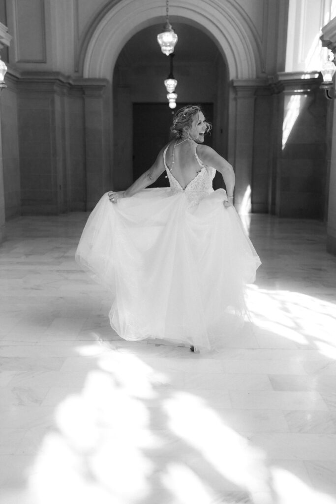 Bride skipping down the hall