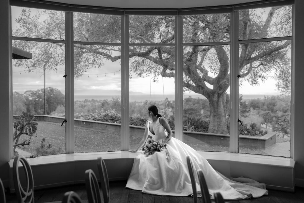 Stunning bride gazes from giant window