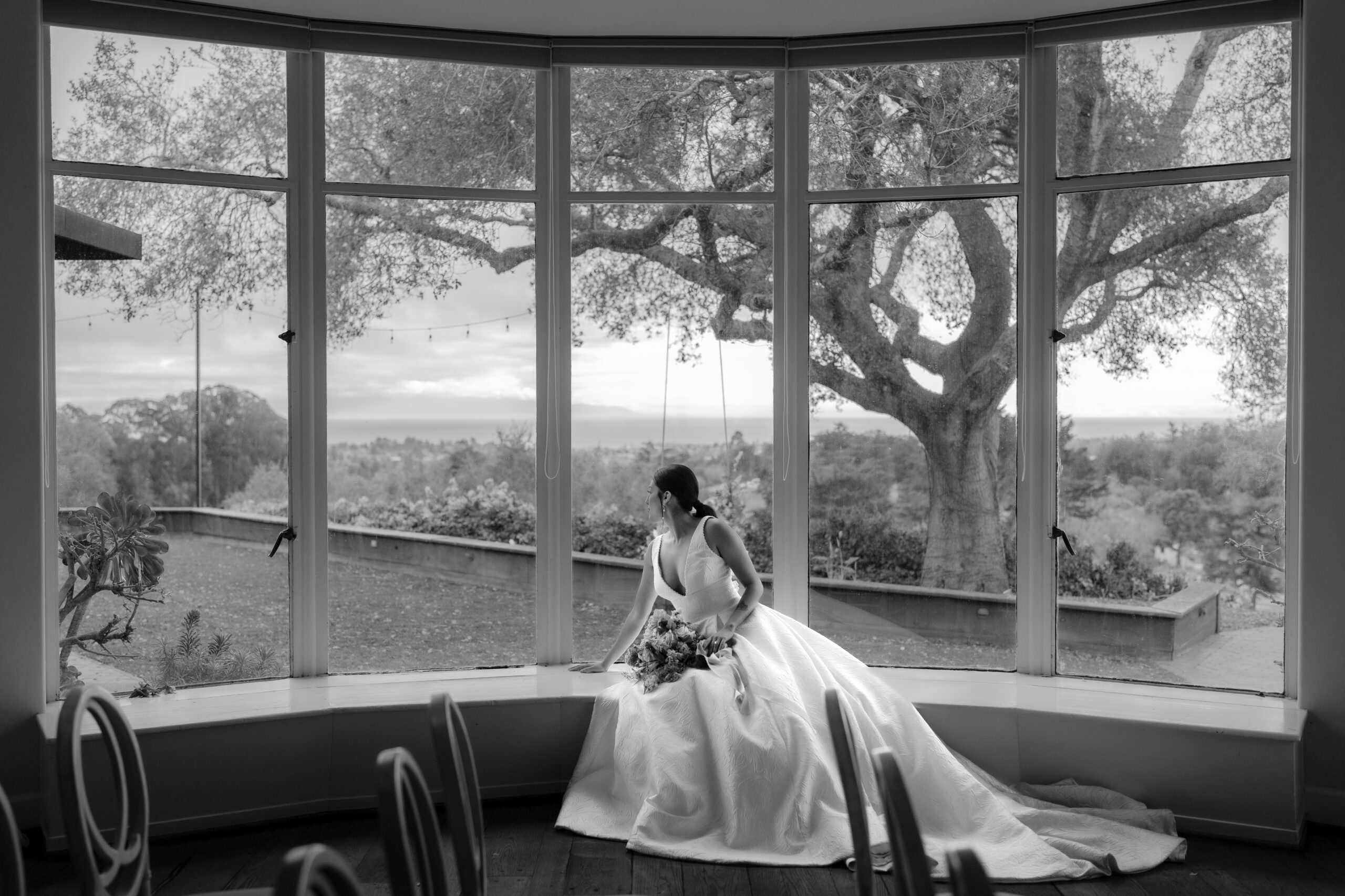 Stunning bride gazes from giant window