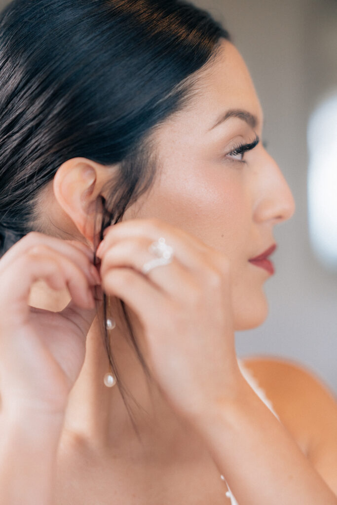 California bride getting ready with earrings