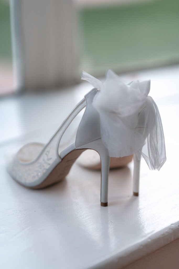 Wedding shoes on a window sill