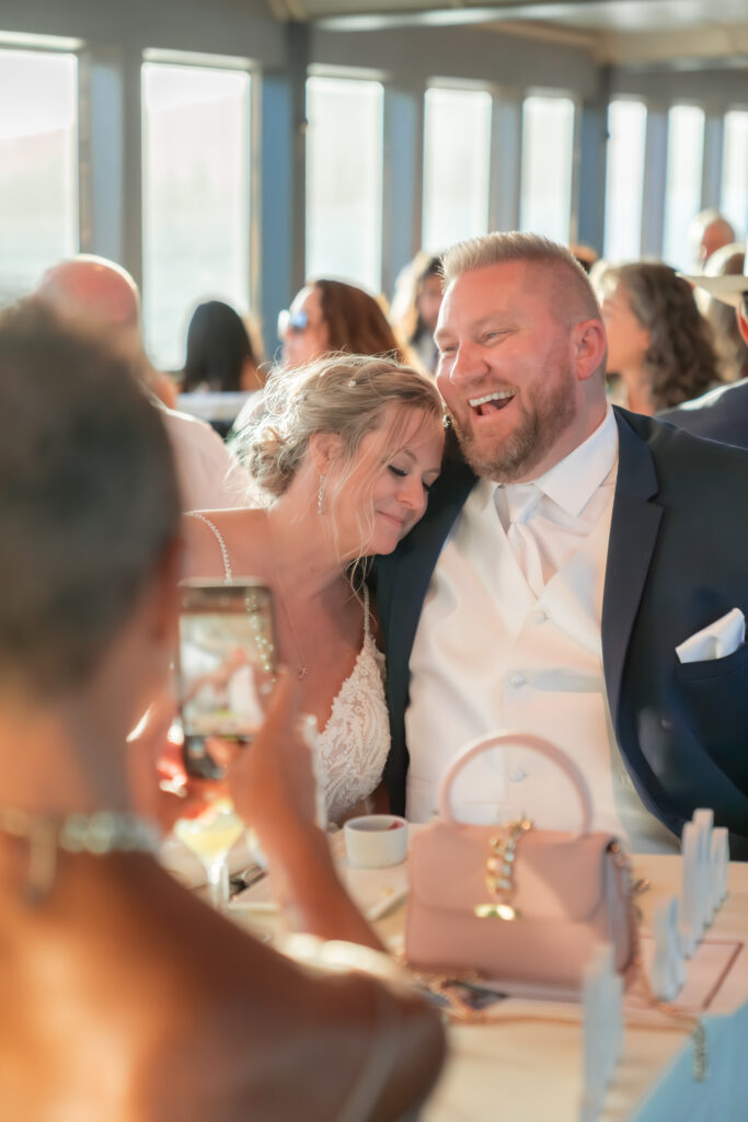 bride and groom taking iphone selfie